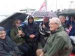 Senior citizens in raincoats